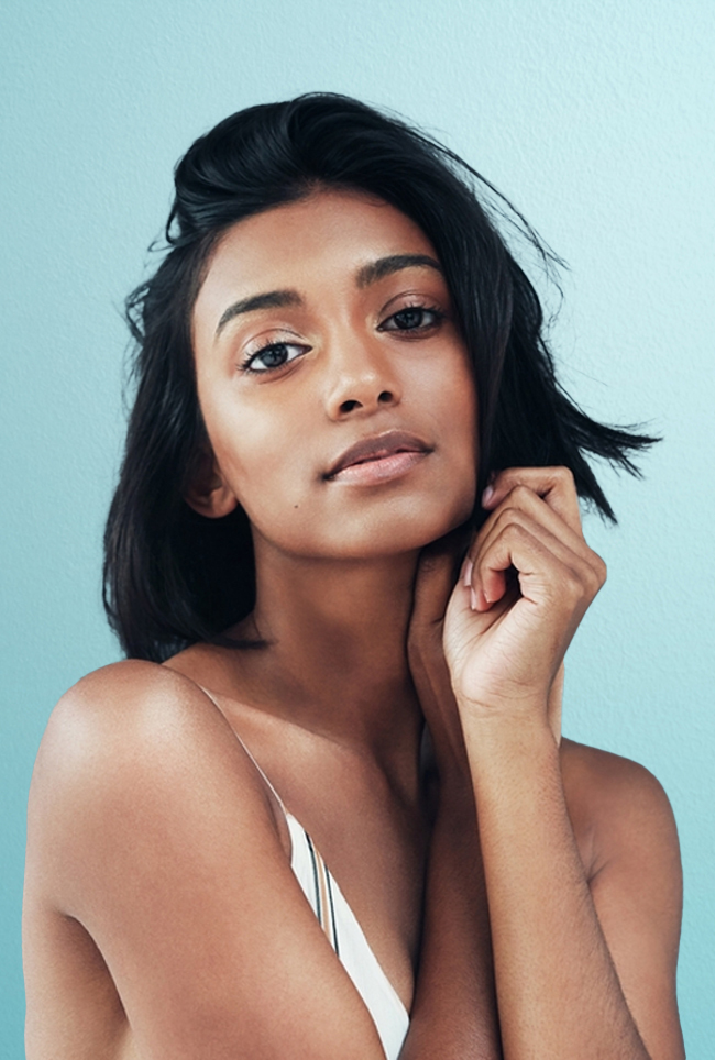 Woman looking forward, resting her face on her chin